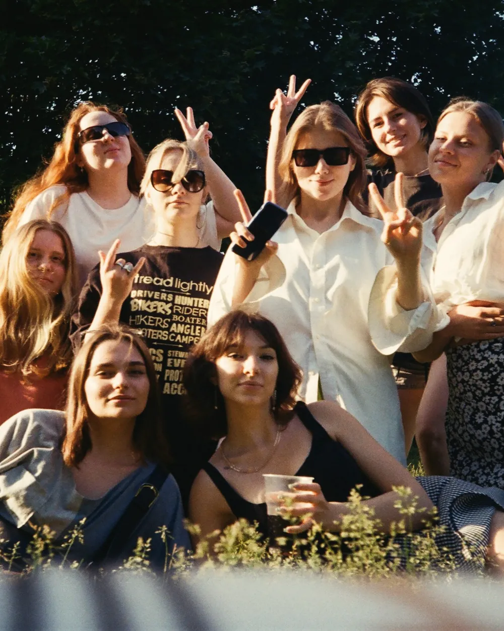 A group of friends outside at golden hour, shot on film